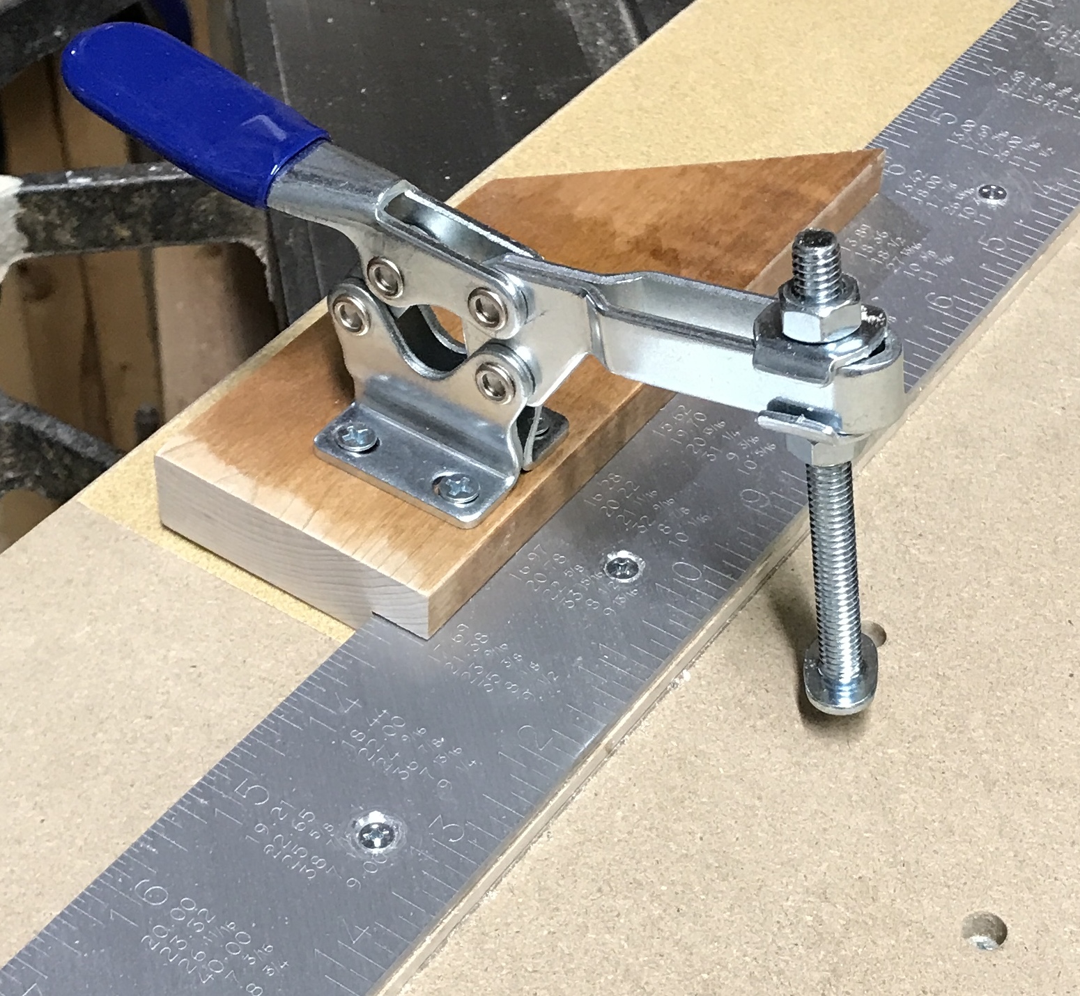 The toggle clamp screwed to the stop block